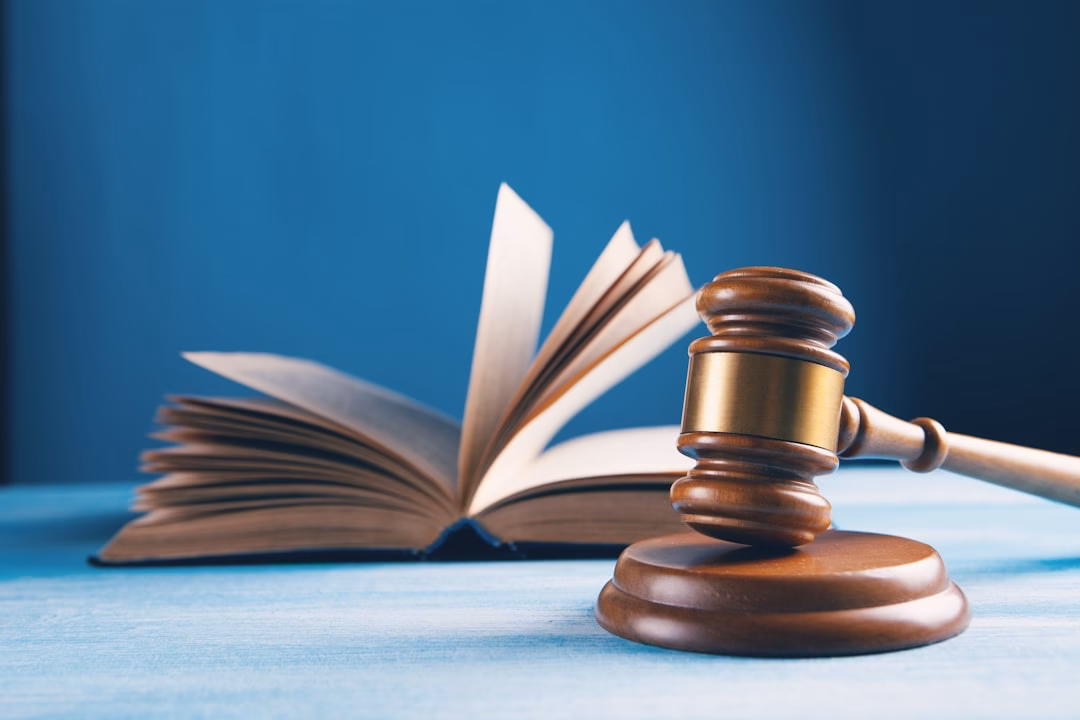 Judge's gavel beside an open law book